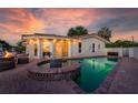 Stunning home with a backyard oasis featuring a gorgeous pool and a tranquil fountain at 3691 Center Cir, Largo, FL 33774