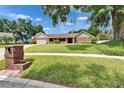 Brick single-story home with inviting front yard and attached garage at 414 Summit Chase Dr, Valrico, FL 33594