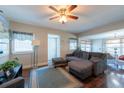 Comfortable living room with hardwood floors, stylish decor, and an open layout to the dining area at 5106 15Th S Ave, Gulfport, FL 33707