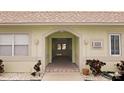 Inviting entrance with a brick pathway and tiled archway at 600 71St Ave # 16, St Pete Beach, FL 33706