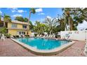 Enjoy the inviting pool surrounded by lush landscaping and lounge chairs for relaxation at 600 71St Ave # 16, St Pete Beach, FL 33706