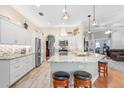 Modern kitchen featuring white cabinetry, granite countertops, and stainless steel appliances at 613 Sportsman Park Dr, Seffner, FL 33584
