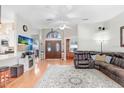 Spacious living room with hardwood floors, large windows, and open concept layout at 613 Sportsman Park Dr, Seffner, FL 33584