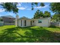 Spacious backyard featuring lush green grass, a private fence and ample sunlight at 6282 41St N Ave, St Petersburg, FL 33709