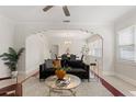 Stylish living room with elegant archway, comfortable seating, and ample natural light at 909 E 15Th Ave, Tampa, FL 33605