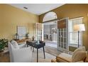 Cozy home office with a desk, chair, and natural light filtering through the blinds at 12009 Wandsworth Dr, Tampa, FL 33626