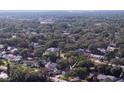 Aerial view of a neighborhood with lush greenery, highlighting the property's location at 1841 Georgia Ave, Palm Harbor, FL 34683