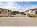Exterior shot of the parking lot with a view of the condos, displaying ample parking space for residents and guests at 19029 Us Highway 19 N # 5-14, Clearwater, FL 33764