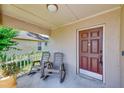 Cozy front porch with seating, perfect for relaxing and enjoying the neighborhood at 22943 Sills Loop, Land O Lakes, FL 34639