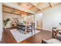 Dining room featuring a decorative ceiling, chandelier, hardwood floors, and a wooden table set for eight at 2354 Messenger Cir, Safety Harbor, FL 34695