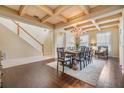 Dining room featuring a decorative ceiling, chandelier, hardwood floors, and a table set for eight at 2354 Messenger Cir, Safety Harbor, FL 34695