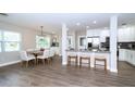 Modern kitchen with white cabinets, stainless steel appliances, and an open layout for easy entertaining at 415 Mission Hills Ave, Temple Terrace, FL 33617