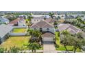 Aerial view of a beautiful home with a large lawn and surrounding community at 419 Stone Briar Dr, Ruskin, FL 33570