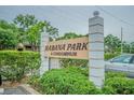 Welcome to Habana Park Condominiums, where lush greenery surrounds the entrance sign at 4708 Michael Ct # 104, Tampa, FL 33614