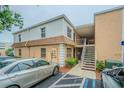Charming exterior of a condominium complex with well-kept landscaping and convenient parking at 4708 Michael Ct # 104, Tampa, FL 33614