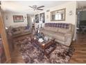 Inviting living room features neutral tones, comfortable seating, and a decorative rug at 4902 Panorama Ave, Holiday, FL 34690