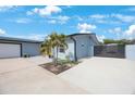 Well-kept single-Gathering home featuring a two-car garage, a nicely landscaped yard, and a privacy gate at 965 S Florida Ave, Tarpon Springs, FL 34689