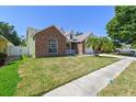 Attractive single-Gathering home with manicured lawn, brick accents, white siding, and a two-car garage at 9709 Bay Colony Dr, Riverview, FL 33578