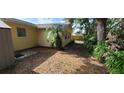 Backyard with mature trees, providing ample shade at 9805 110Th Ln, Seminole, FL 33772