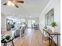 Open-concept living space seamlessly blends the living room, kitchen, and dining area, creating an inviting atmosphere at 9929 Bay Dr, Gibsonton, FL 33534