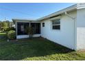 Lush backyard featuring a screened-in patio, with a well maintained lawn at 10169 45Th N St, Pinellas Park, FL 33782