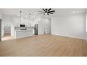 Bright and airy living room with hardwood floors, modern lighting, and an open floor plan at 1625 39Th S St, St Petersburg, FL 33711