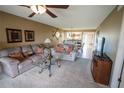 Comfortable living room featuring plush carpeting and casual seating at 1846 Golfview Dr # 1846, Tarpon Springs, FL 34689