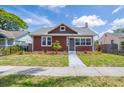 Charming single-Gathering home featuring a well-maintained lawn and a brick chimney at 2723 8Th N Ave, St Petersburg, FL 33713