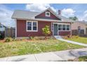 Charming single-Gathering home featuring a well-maintained lawn and a brick chimney at 2723 8Th N Ave, St Petersburg, FL 33713