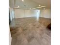 Bright open room with tile floors and recessed lighting, perfect for entertaining and relaxation at 3504 Crooked River Dr, Plant City, FL 33565