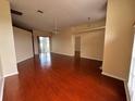 Bright and airy living room with hardwood floors and plenty of natural light at 6213 Ashfield Pl, Wesley Chapel, FL 33545