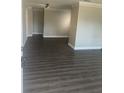 Hallway with luxury vinyl plank flooring leading to the bathroom and other rooms at 639 48Th N Ave, St Petersburg, FL 33703