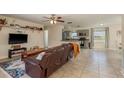Cozy living room with tile floors, a comfortable sofa, and open access to the modern kitchen at 920 York Dr, Brandon, FL 33510
