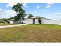 Well-maintained single-Gathering home with a spacious front yard, driveway and solar panels on the roof at 11123 Thornberry Dr, Spring Hill, FL 34609