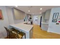 Modern kitchen featuring stainless steel appliances, quartz countertops, and stylish gray cabinetry at 1200 47Th St N, St Petersburg, FL 33713