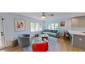 Cozy living room with ample natural light, stylish furnishings, and a comfortable seating arrangement at 1200 47Th St N, St Petersburg, FL 33713