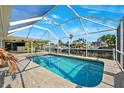 Beautiful screened-in pool with a view of the canal at 1399 49Th Ne Ave, St Petersburg, FL 33703