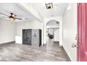 Entryway featuring tile flooring, security safes, and an arched doorway leading to the living room at 14135 Arbor Pines Dr, Riverview, FL 33579