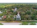 Aerial view of a home nestled among lush trees, offering a sense of privacy at 2318 Kenwick Dr, Valrico, FL 33596