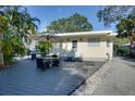 Cozy backyard deck area with seating, perfect for relaxing and entertaining outdoors at 284 North St, Palm Harbor, FL 34683