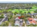An aerial view of the home showcasing its location near a golf course and lush greenery at 3105 W San Isidro St, Tampa, FL 33629