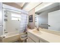 Bright bathroom with a shower-tub combo, sink, and vanity at 5540 Applegate Dr, Spring Hill, FL 34606