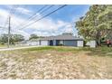 Charming single-story home with a well-maintained lawn and attached garage at 5540 Applegate Dr, Spring Hill, FL 34606
