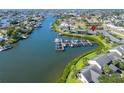Waterfront condo community featuring a private boat dock and lush landscaping on a scenic canal at 644 Yardarm Dr # 22, Apollo Beach, FL 33572