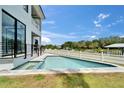 Beautiful backyard pool and spa, perfect for relaxation and outdoor entertaining on sunny days at 6520 Simone Shores Cir, Apollo Beach, FL 33572