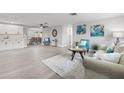 Bright living room featuring neutral tones, modern furnishings, and an open layout with a dining area at 6804 Tierra Verde St, Port Richey, FL 34668