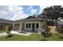 Beautiful home with a covered porch and manicured front yard, perfect for enjoying neighborhood views at 7011 N 15Th St, Tampa, FL 33610