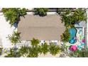 Bird's-eye view of home showing its sprawling backyard, pool, and outdoor dining at 722 Gulf Blvd, Indian Rocks Beach, FL 33785