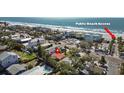 Aerial view of a charming home near a public beach access point and a private swimming pool at 819 Gulf Blvd, Indian Rocks Beach, FL 33785