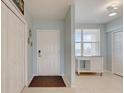 Welcoming condo entry with white doors, tile flooring and a view of the outside at 960 Starkey Rd # 2405, Largo, FL 33771